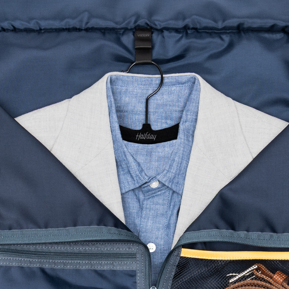 Travel Hanger close-up of a jacket & Shirt inside a garment area of a bag