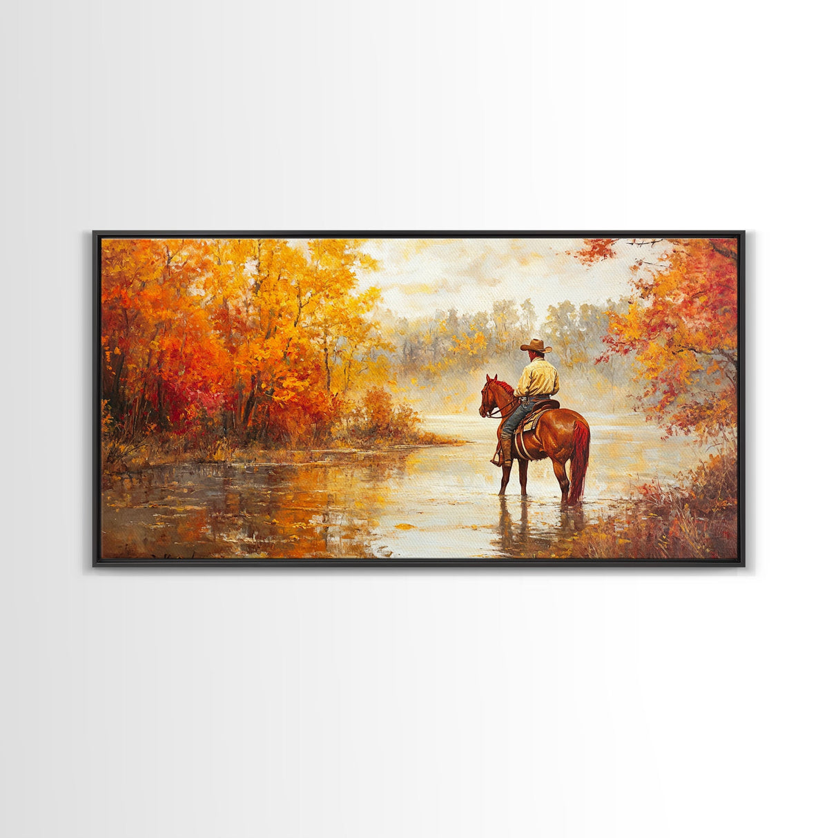 Cowboy sitting by campfire near a lake in the woods with autumn leaves, Framed Canvas Print, moody fall wall art, rustic western home decor