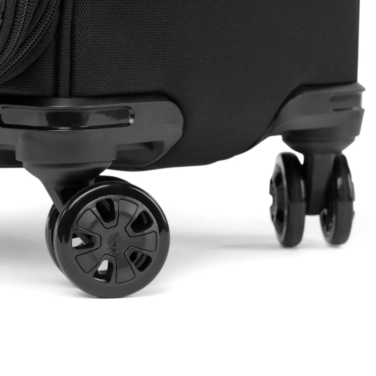Close-up of the 360° MagnaTrac wheels on the Travelpro Crew Classic large check-in spinner