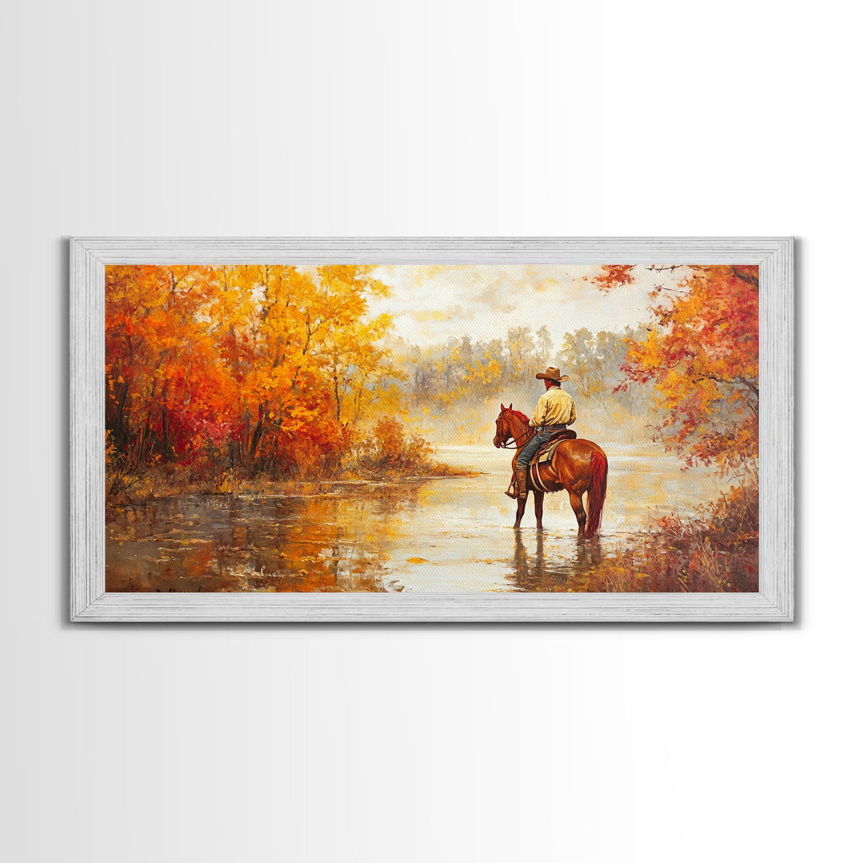 Cowboy sitting by campfire near a lake in the woods with autumn leaves, Framed Canvas Print, moody fall wall art, rustic western home decor
