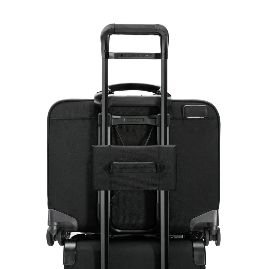 Briggs & Riley @work Large Spinner Brief in Black - Back view with interlocking trolley handle for stacking on another bag