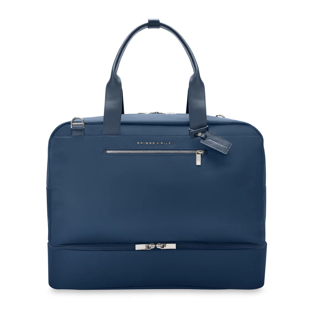 Briggs & Riley Rhapsody Weekender Tote in navy blue with matching navy leather handles and trim, front zip pocket, and leather fob, shown from the front