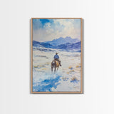 Cowboy riding through snowy mountain pass, Framed Canvas Print, western winter landscape wall art, farmhouse holiday decor Christmas gift