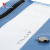 Close-up of a Steel Blue TILLIV Compak pack showing the embossed TILLIV logo, the grey one-way valve and the airtight zipper