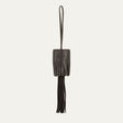 WILL Leather Goods key fob tassel in black leather, fringed tassel with embossed WILL Leather Goods patch and brass loop, on a white background.