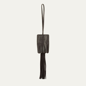 WILL Leather Goods key fob tassel in black leather, fringed tassel with embossed WILL Leather Goods patch and brass loop, on a white background.