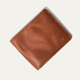 Will Leather Goods Classic Billfold Wallet in tan leather, closed, top-down view on a white background.