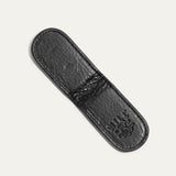 Underside view of the black Classic Money Clip showing the smooth leather sole and embossed WILL Leather Goods, Eugene Oregon stamp.