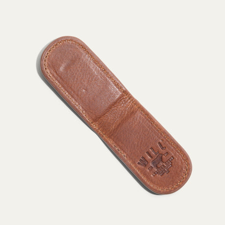 Underside view of the tan Classic Money Clip showing the smooth leather sole and embossed WILL Leather Goods, Eugene Oregon stamp.