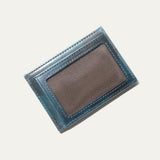 Close-up of the blue camo leather card case's back panel showing card slots and embossed cattle logo