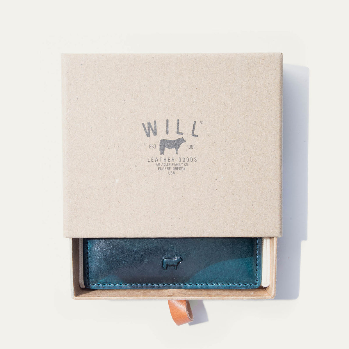 Blue camo leather card case in an open Will Leather Goods branded gift box