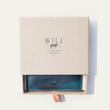 Blue camo leather card case in an open Will Leather Goods branded gift box