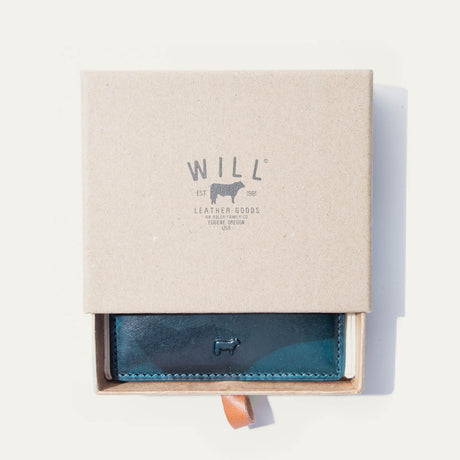 Blue camo leather card case in an open Will Leather Goods branded gift box