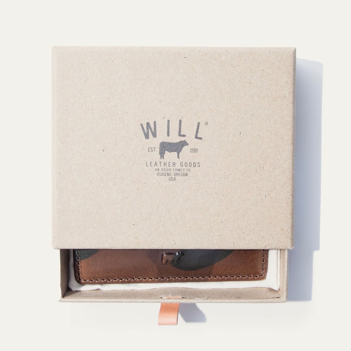 Brown camo leather card case in an open Will Leather Goods branded gift box