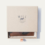 Brown camo leather card case in an open Will Leather Goods branded gift box
