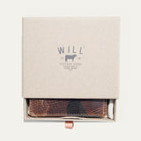 The green camouflage Military Front Pocket wallet in its WILL Leather Goods gift box, nested in white tissue with a leather pull-tab.