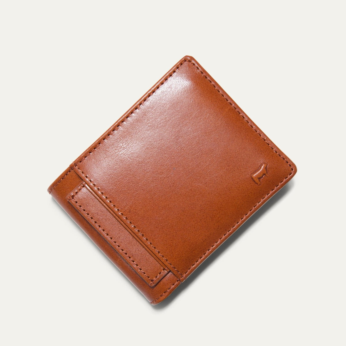 Companion Billfold Wallet by WILL Leather Goods in cognac leather, closed bifold, angled product view on a white background.