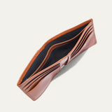 Companion Billfold Wallet by WILL Leather Goods in cognac leather, interior view of the empty unfolded bifold showing the card slots and bill compartment.