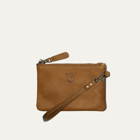 Will Leather Goods tan leather small zip pouch, flat lay with wristlet strap