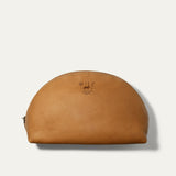 Will Leather Goods Zip Cosmetic bag in tan leather, half-moon shape with brass zipper and embossed WILL logo, product shot on a white background.