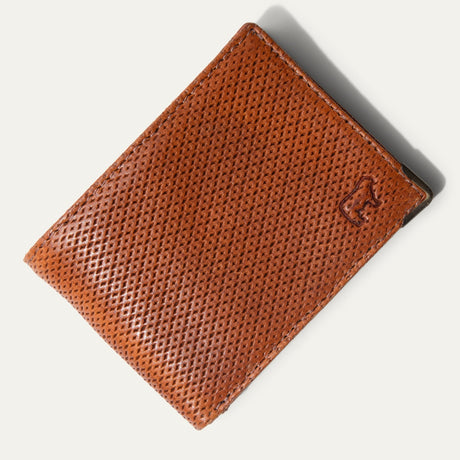 The William Collection Mogul Billfold in ginger diamond-perforated leather, open to show the card slots, embossed WILL logo, and mesh ID window.