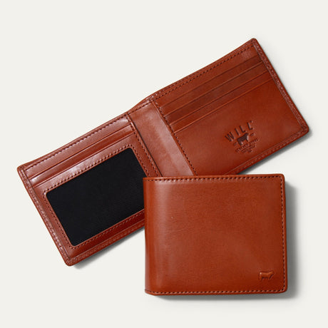 Will Leather Goods Classic Billfold Wallet in amber/cognac leather, open interior showing card slots, a clear ID window, and closed exterior view, on a white background.