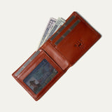Amber/cognac leather billfold wallet open, card pocket holding cash and an ID visible through the clear window, on a white background.