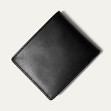 Black leather billfold wallet open, showing card slots, embossed WILL Leather Goods logo, and a clear ID window, on a white background.