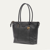 Black pebbled leather zip tote, three-quarter angle view showing the side gusset and zipper