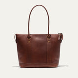 Dark cognac pebbled leather zip tote, straight-on front view showing the WILL brand patch and zip pull