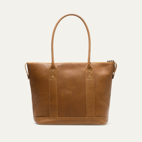 Tan pebbled leather zip tote, straight-on front view showing the WILL brand patch and zip pull