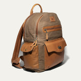 Side angle of the olive canvas Canvas + Leather Backpack showing the tan leather top handle, side pockets, and adjustable straps.