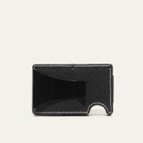 Mondrian Card Case by WILL Leather Goods in black leather, front view with credit cards and folded cash held by the steel money clip.