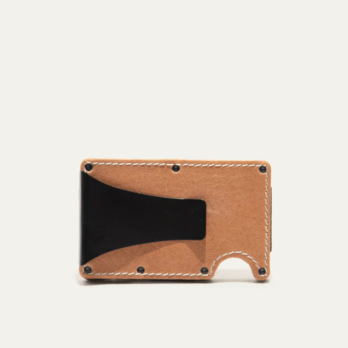 Mondrian Card Case by WILL Leather Goods in brown leather, front view with credit cards and folded cash held by the steel money clip, viewed at a slight angle.