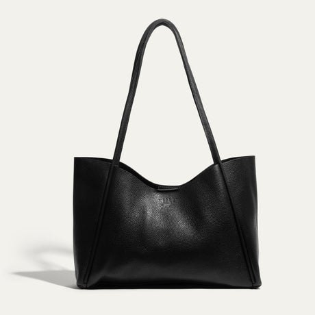 Front-facing view of the black Workshop Tote in pebbled leather on a white background.