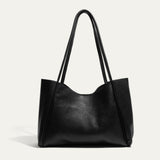 Will Leather Goods Workshop Tote in black pebbled leather, shown front-facing on a white background with tall shoulder straps.