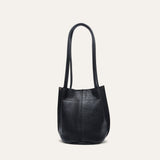 Top-down view into the empty black leather bucket bag, showing the magnetic snap closure