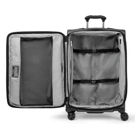 Interior of the Travelpro Crew Classic medium check-in spinner with hold-down straps and divider