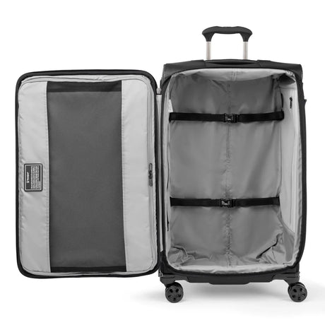 Interior of the Travelpro Crew Classic large check-in spinner with hold-down straps and zippered divider