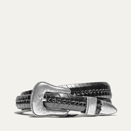 Black tapered leather belt with woven lace-wrapped strap texture and an ornate engraved silver western buckle set, coiled view.