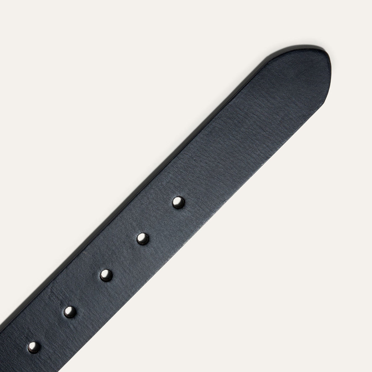 Black Edge Jean Belt by WILL Leather Goods in cognac leather with a black burnished edge, coiled front product view showing the brass buckle, on a white background.