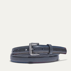 Rainbow Stitched Belt by WILL Leather Goods in navy leather with multicolor blue, tan, and red edge stitching, brushed nickel buckle, coiled front product view on a white background.