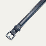 Close-up of the Rainbow Stitched Belt buckle in navy leather, showing the brushed nickel roller buckle and multicolor edge stitching.
