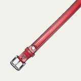 Close-up of the Rainbow Stitched Belt strap tip in red leather, showing the multicolor edge stitching and row of adjustment holes.