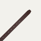 Close-up of dark brown leather belt strap showing the pointed tip end with adjustment holes.