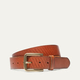 Razor Cut Belt by WILL Leather Goods in cognac leather with fine diagonal laser-cut striping, brass buckle, coiled front product view on a white background.