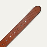 Close-up of the Razor Cut Belt strap in cognac leather, showing the fine diagonal razor-cut striping and row of adjustment holes near the rounded tip.
