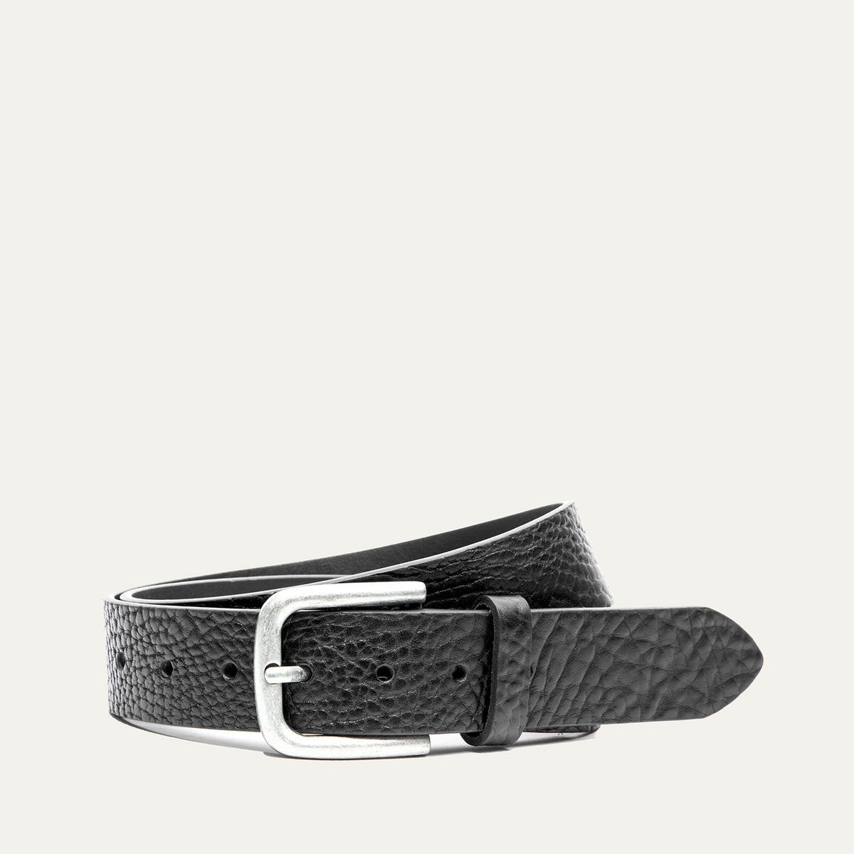 Shrunken American Bison Belt by WILL Leather Goods in black pebbled bison leather with a brushed nickel buckle, coiled front product view on a white background.