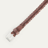 Close-up of the brown Five Strand Braided Belt's brushed silver buckle and keeper loop, showing the five-strand leather braid detail.