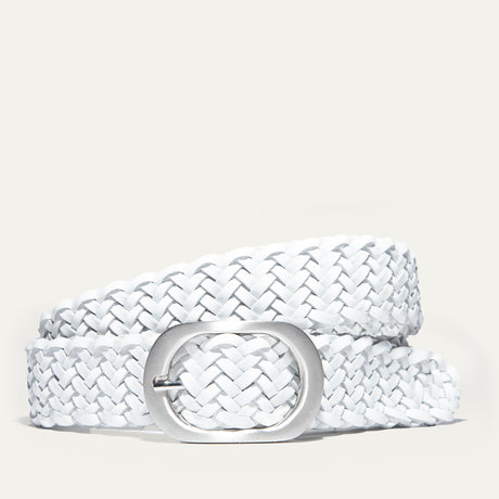 Will Leather Goods Twelve Strand Luxe Crafted Braided Belt in white leather, coiled on a white background with a brushed silver oval buckle.